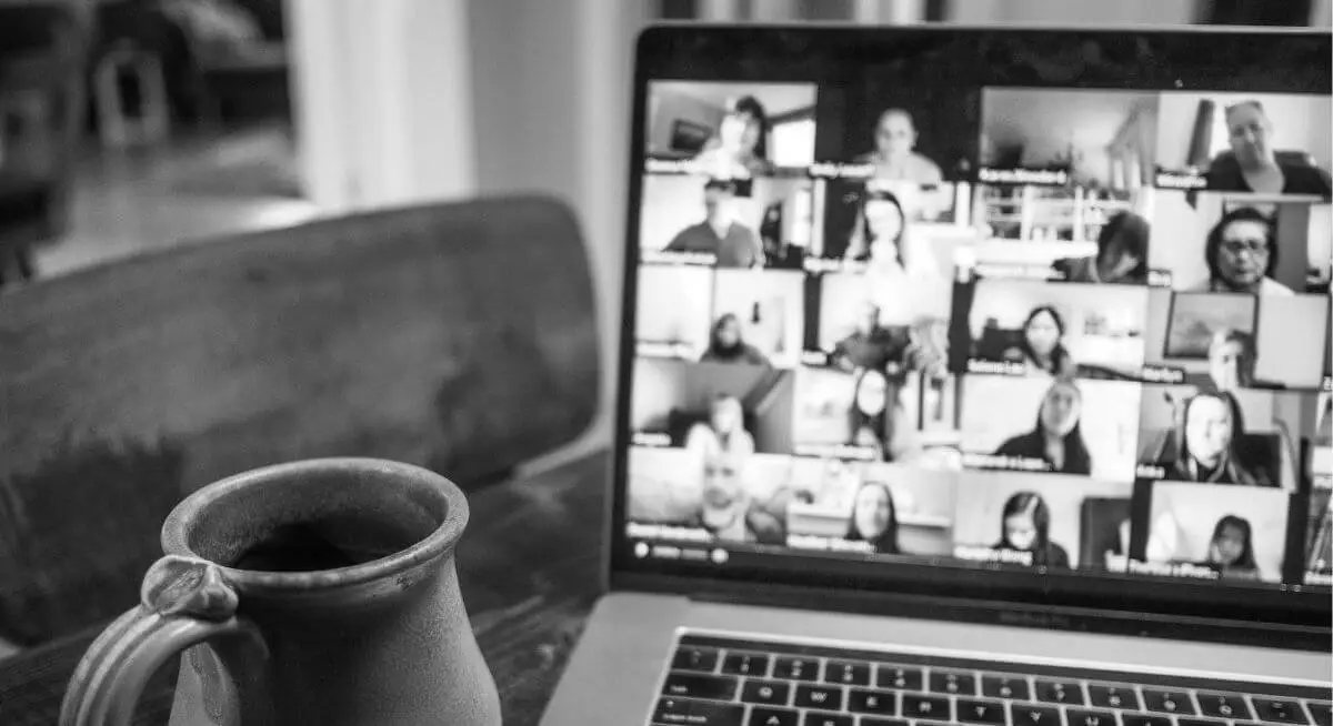 Laptop displaying a zoom meeting taking place